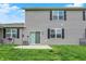 Well-maintained backyard with a patio, lush green grass, and exterior features at 6429 Yuma Ct, Whitestown, IN 46075