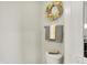 A bathroom space is decorated with a golden wreath and towels adding an elegant touch at 6429 Yuma Ct, Whitestown, IN 46075