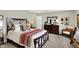 Bedroom features a cozy bed, dark wood furniture, and neutral wall color at 6429 Yuma Ct, Whitestown, IN 46075