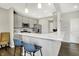 Contemporary kitchen with an island, stainless steel appliances, and stylish bar stools at 6429 Yuma Ct, Whitestown, IN 46075