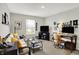 Inviting living room with sofa, media center, and desk area at 6429 Yuma Ct, Whitestown, IN 46075