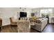 Inviting living room featuring a cozy seating arrangement, modern decor, and hardwood floors at 6429 Yuma Ct, Whitestown, IN 46075