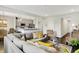 Spacious living room with an open floor plan, comfortable seating, and view of the kitchen at 6429 Yuma Ct, Whitestown, IN 46075