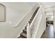 Stairway with carpeted steps and white railings leading to the upper level of the home at 6429 Yuma Ct, Whitestown, IN 46075