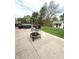 Backyard with patio, dining set, hot tub, fire pit, and storage shed at 6550 Spring Flower Dr, Indianapolis, IN 46237