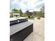 Backyard patio with a hot tub, heater and fire pit at 6550 Spring Flower Dr, Indianapolis, IN 46237