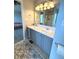 Bathroom featuring a double sink vanity and a separate shower stall, designed for convenience at 6550 Spring Flower Dr, Indianapolis, IN 46237