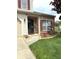 Inviting front entrance with brick accents, manicured landscaping, and a paved walkway and flower box at 6550 Spring Flower Dr, Indianapolis, IN 46237