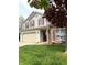 Charming two-story home with red shutters, attached garage, and well-maintained lawn and garden at 6550 Spring Flower Dr, Indianapolis, IN 46237