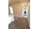 Hallway with neutral carpet and paint, leading to various rooms and enhancing the home's flow at 6550 Spring Flower Dr, Indianapolis, IN 46237