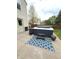 Backyard patio featuring a modern hot tub and outdoor seating at 6550 Spring Flower Dr, Indianapolis, IN 46237