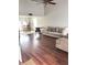 Open living room featuring hardwood floors, a vaulted ceiling, and ample natural light with neutral tones at 6550 Spring Flower Dr, Indianapolis, IN 46237