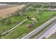 Aerial view with rural road, highway, lush greenery, farm buildings and open fields at 6585 N Waverly Park Rd, Martinsville, IN 46151