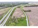 A captivating aerial view of rolling fields adjacent to a multilane highway, showcasing the property's accessible location at 6585 N Waverly Park Rd, Martinsville, IN 46151