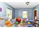 Cheerful ' room with ample natural light from two windows, toys and colorful decor at 6585 N Waverly Park Rd, Martinsville, IN 46151