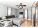 Bedroom with wood floors, ceiling fan, and gray walls offers a comfortable and well-lit space at 6585 N Waverly Park Rd, Martinsville, IN 46151