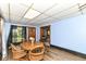 Cozy dining room with wood floors and a round table next to a window provides natural light and charm at 6585 N Waverly Park Rd, Martinsville, IN 46151
