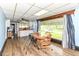 Cozy dining area flows into the kitchen, offering a view of the backyard through a large picture window at 6585 N Waverly Park Rd, Martinsville, IN 46151