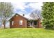 Charming brick home with a well-maintained lawn and inviting entrance at 6585 N Waverly Park Rd, Martinsville, IN 46151
