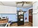 Kitchen featuring white cabinets, wood floors, and a black refrigerator at 6585 N Waverly Park Rd, Martinsville, IN 46151