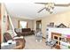 Comfortable living room area with plush seating, fireplace, and ceiling fan at 6585 N Waverly Park Rd, Martinsville, IN 46151