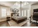 Bedroom with large windows, vaulted ceiling, and aviation decor at 6734 W Stonegate Dr, Zionsville, IN 46077