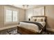 Bedroom featuring a wood-framed bed and large window with shutters at 6734 W Stonegate Dr, Zionsville, IN 46077