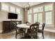 Sunlit dining room with a chandelier and views of the landscape at 6734 W Stonegate Dr, Zionsville, IN 46077