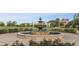 A beautiful outdoor fountain with lush landscaping and benches, creating a tranquil and inviting space at 6734 W Stonegate Dr, Zionsville, IN 46077