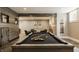 Basement game room with pool table, comfortable seating, and a neutral color palette at 6734 W Stonegate Dr, Zionsville, IN 46077