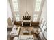 Aerial view of a living room with a fireplace and lots of natural light at 6734 W Stonegate Dr, Zionsville, IN 46077