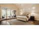 Elegant main bedroom boasts vaulted ceilings, shiplap walls, sliding doors to a cozy patio at 6734 W Stonegate Dr, Zionsville, IN 46077