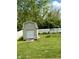 Spacious backyard featuring a shed, swing set, and lush green grass at 6903 Governors Pointe Blvd, Indianapolis, IN 46217