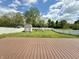 Expansive backyard view from the deck, complete with a storage shed, swing set and white picket fence at 6903 Governors Pointe Blvd, Indianapolis, IN 46217