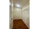 This walk-in closet features wood floors, wire shelving, and an electrical outlet for convenience at 6903 Governors Pointe Blvd, Indianapolis, IN 46217