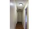 This hallway features hardwood floors, neutral walls, and access to other rooms in the home at 6903 Governors Pointe Blvd, Indianapolis, IN 46217