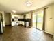 Well-lit kitchen with stainless steel appliances and sliding door access to the backyard at 6903 Governors Pointe Blvd, Indianapolis, IN 46217