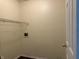 The laundry room features a utility sink, wire shelving, and washer/dryer hookups at 6903 Governors Pointe Blvd, Indianapolis, IN 46217