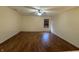 Spacious living room boasts wood floors, a window, and plenty of natural light for a comfortable living space at 6903 Governors Pointe Blvd, Indianapolis, IN 46217