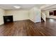 Spacious living room with wood flooring and a black fireplace insert at 6903 Governors Pointe Blvd, Indianapolis, IN 46217