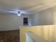 Bright living room area with hardwood floors and a ceiling fan at 6903 Governors Pointe Blvd, Indianapolis, IN 46217
