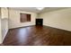 A vacant living room with new wood floors and black gas fireplace at 6903 Governors Pointe Blvd, Indianapolis, IN 46217