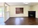 A vacant living room with new wood floors and black gas fireplace at 6903 Governors Pointe Blvd, Indianapolis, IN 46217