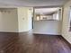 A vacant living room with new wood floors with a view to the kitchen at 6903 Governors Pointe Blvd, Indianapolis, IN 46217