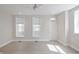 Bright bedroom with hardwood floors, a modern ceiling fan, and plenty of natural light at 701 Lincoln St, Indianapolis, IN 46203