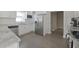 Modern kitchen features stainless steel appliances, white cabinets, and light hardwood floors at 701 Lincoln St, Indianapolis, IN 46203