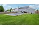 This house features a big backyard with a pool, green grass, and a privacy fence at 7157 Chemistry Ct, Indianapolis, IN 46239