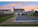 This backyard features a covered pool and has string lights for evening entertaining at 7157 Chemistry Ct, Indianapolis, IN 46239