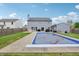 This large backyard has a covered pool, a lush lawn, and is fenced for privacy at 7157 Chemistry Ct, Indianapolis, IN 46239