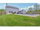 The spacious backyard has a covered pool, well-manicured lawn and access to the house at 7157 Chemistry Ct, Indianapolis, IN 46239
